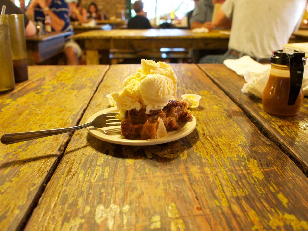 A slice of pecan pie with a dense nut filling