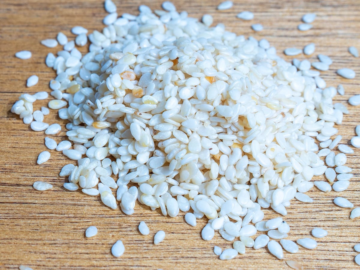 Hulled sesame seeds, small flat and cream coloured
